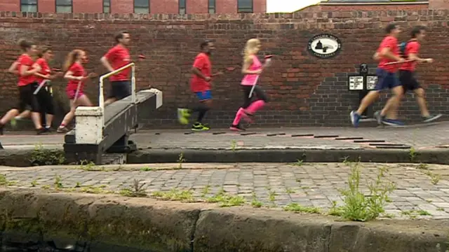 Running group alongside a canal in Birmingham