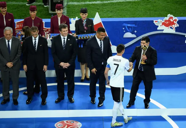 Diego Maradona awards Julian Draxler of Germany the golden ball award