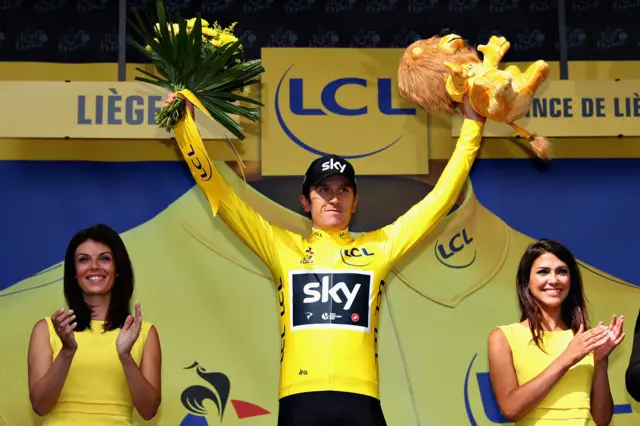 Geraint Thomas celebrates the yellow jersey