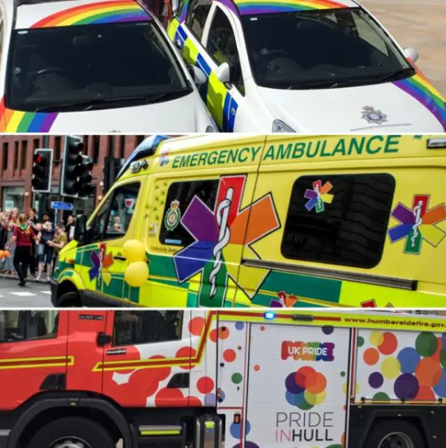 Two police cars, an ambulance and a fire engine covered with rainbow colours to represent UK Pride