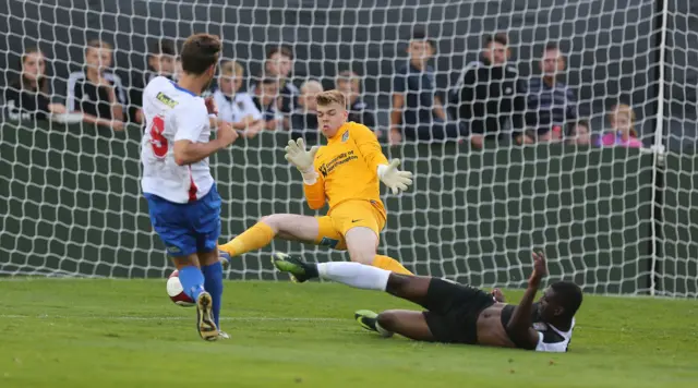 James Goff of Northampton Town saves a shot from Chris Dillon of AFC Rushden & Diamonds during the Pre-Season Friendly match between AFC Rushden & Diamonds and Northampton Town at Hayden Road on 19 July