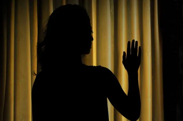 Woman in shadow