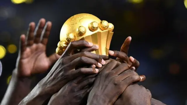 People holding trophy