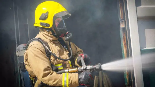 A firefighter in action for Staffordshire Fire Service