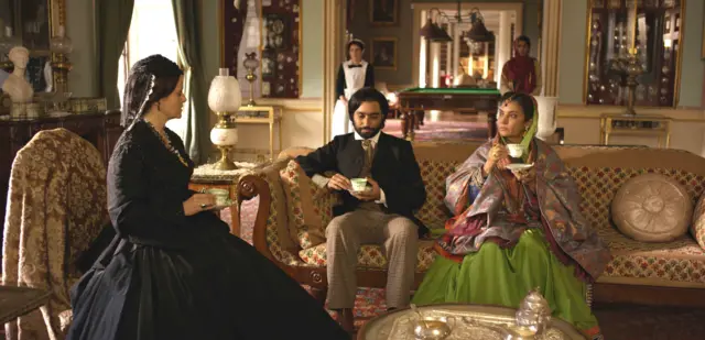 Scene from film of The Black Prince, showing the Prince seated with Queen Victoria