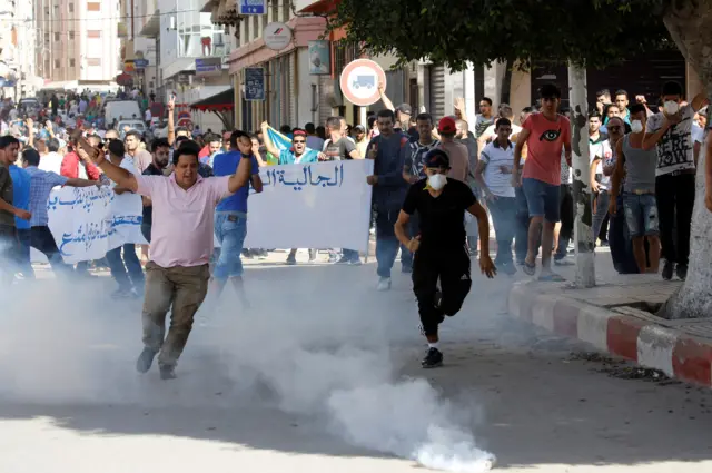 Riot police fired tear gas towards protesters during a demonstration