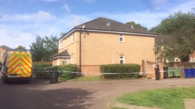 Policeman stands guard outside a house on Cumberland Avenue, Bury St Edmunds