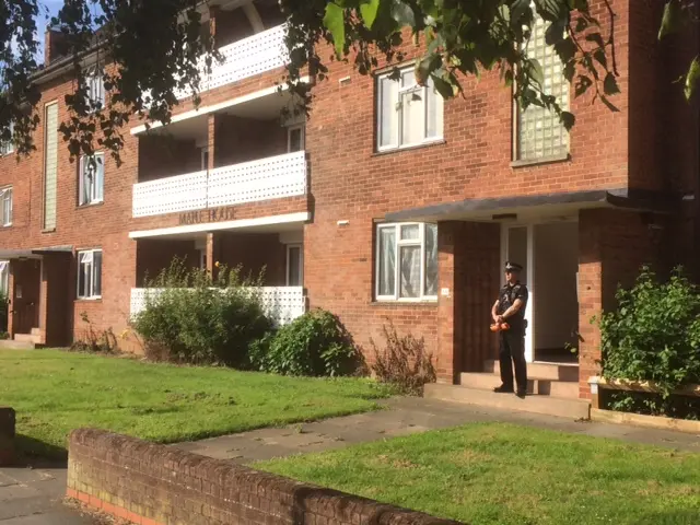 Policeman stands guard at the entrance to Maple House, Bury St Edmunds