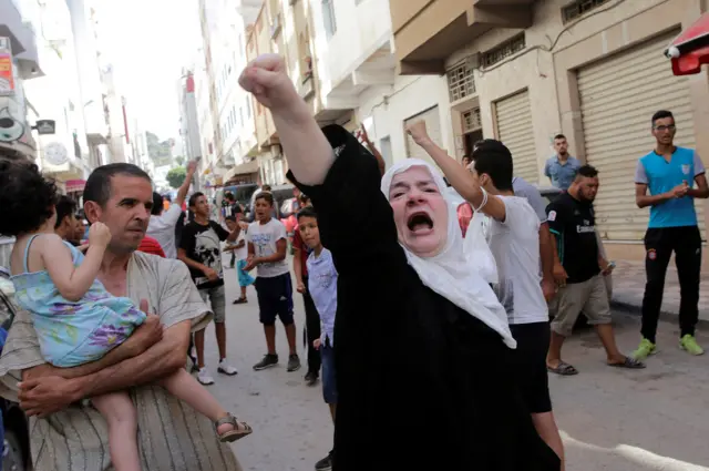 A women shouts a slogan during a demonstration against official abuses and corruption in the town of al-Hoceima