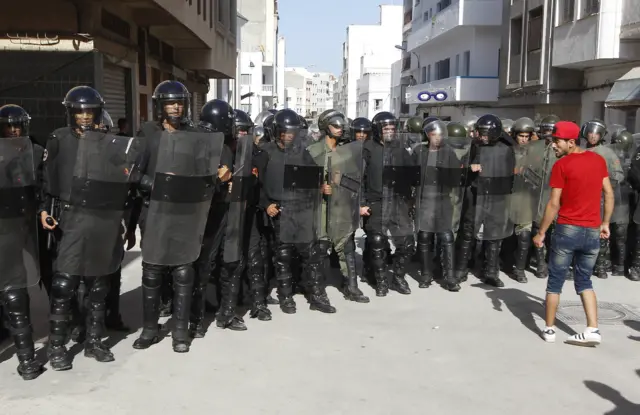 man in front of police