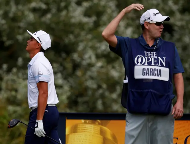 Rickie Fowler and Sergio Garcia's caddie