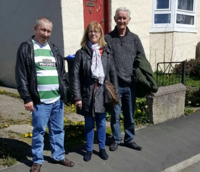 Tommy Chalmers (left), Pat McBain (centre) and Robert Weston (right) outside the house in Turriff where their father lived