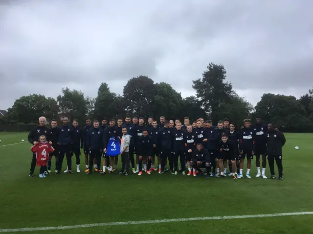 Players with shirts showing EACH lettering