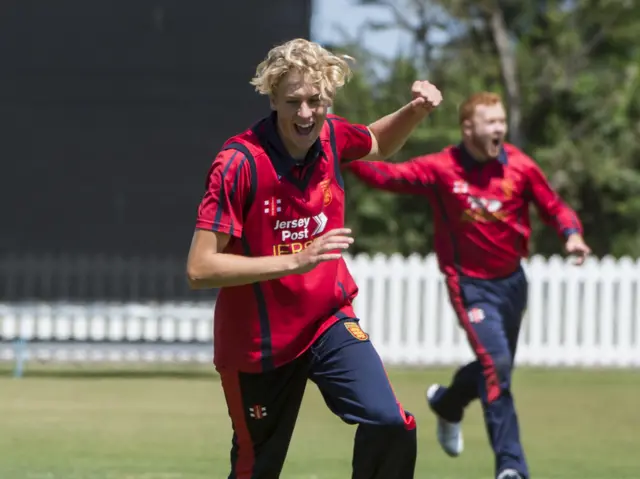A Jersey bowler celebrates a wicket