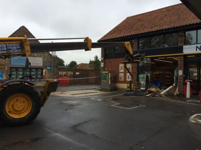 The forklift on the forecourt of the Nisa store