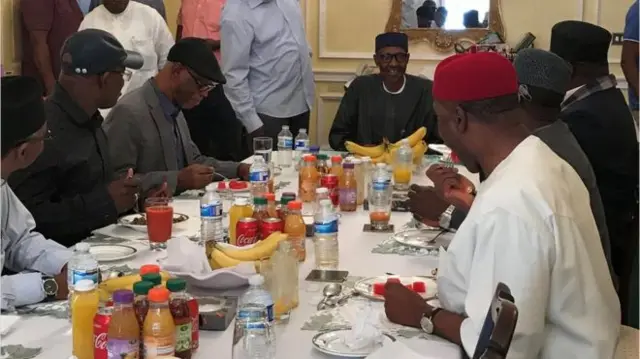 Mr Buhari having lunch with his colleagues