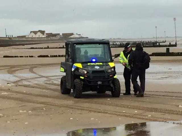 Police officers and the ATV on Hunstanton beach