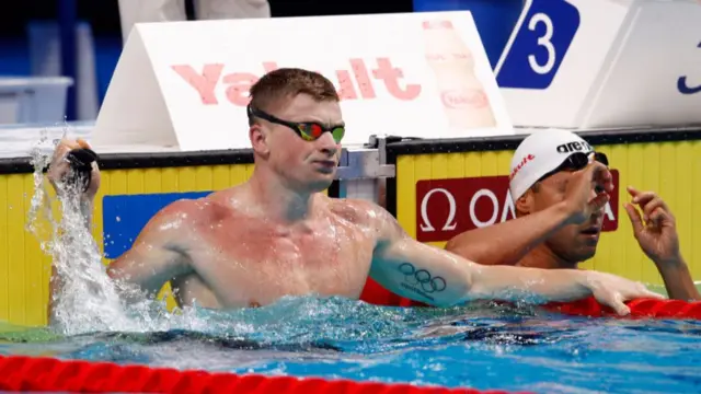 Adam Peaty celebrating the world record