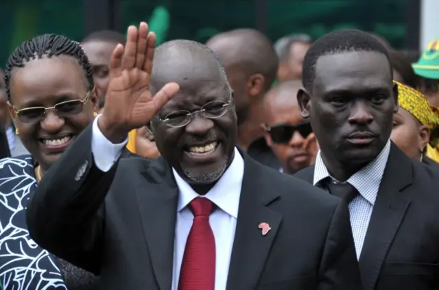 John Pombe Magufuli salutes members of the ruling Chama Cha Mapinduzi Party (CCM) at the party"s sub-head office on Lumumba road in Dar es Salaam, October 30, 2015.