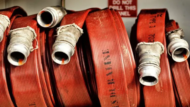 Fire hoses rolled up in a fire engine