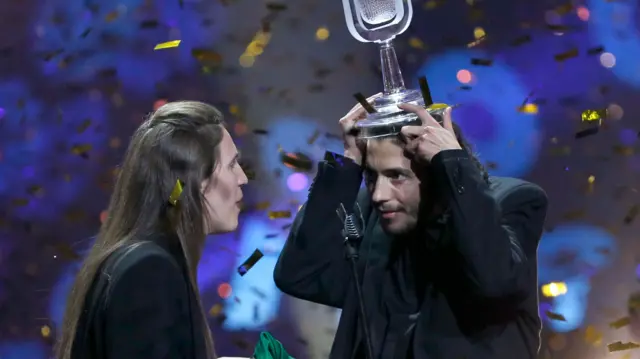 Portugal"s Salvador Sobral celebrates after winning the grand final of the Eurovision Song Contest 2017