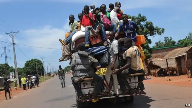 People on back of pick up truck in Central African Republic