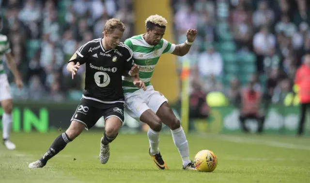 Scott Sinclair of Celtic tussles for possession with Vegar Eggen Hedenstad of Rosenborg