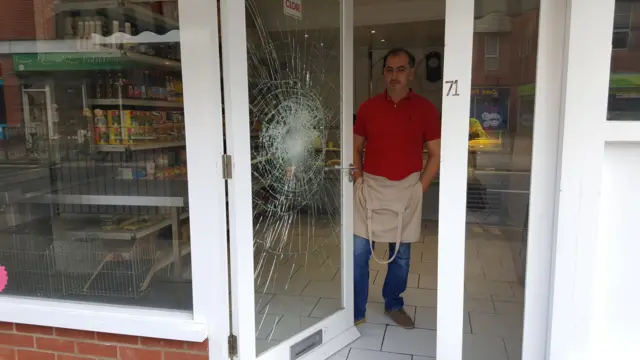 Glass-damaged door of butcher's shop