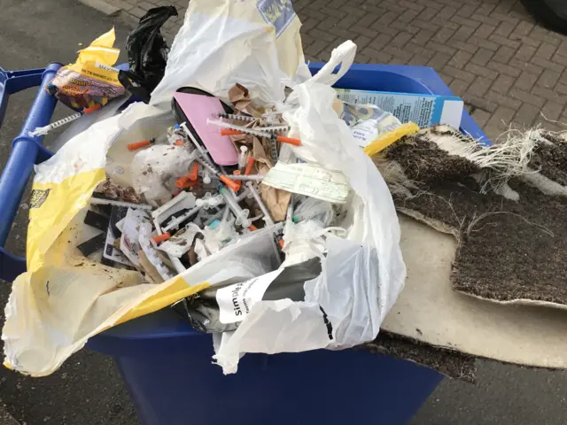 needles in bin