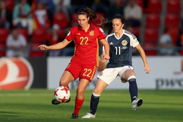 Mariona Caldentey of Spain is put under pressure from Lisa Evans of Scotland