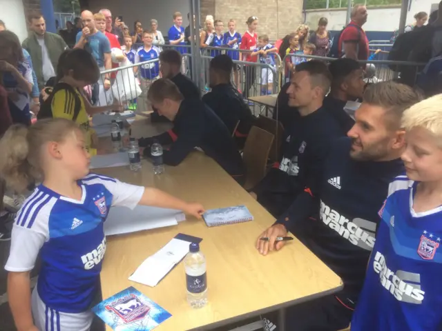 Young fans collect autographs