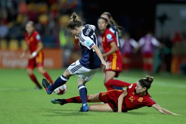 Alexandra of Spain tackles Frankie Brown of Scotland