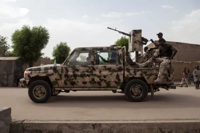 A Nigerian army vehicle patrols in the town of Banki in northeastern Nigeria on April 26, 2017