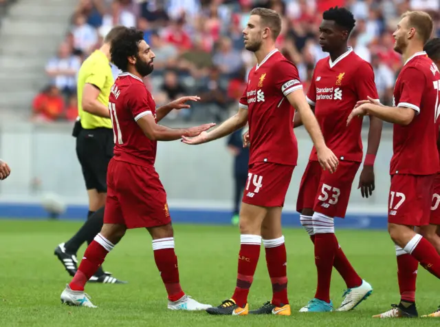 Mohammed Salah celebrates with his Liverpool teammates