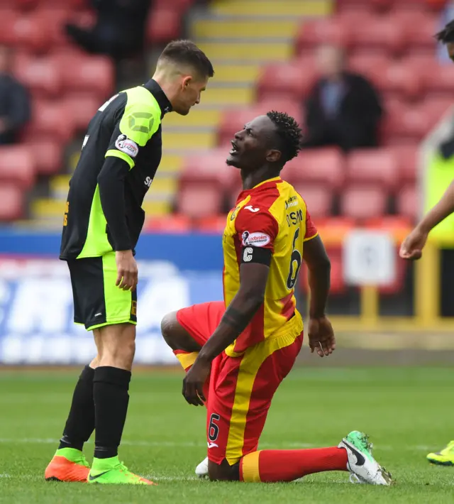 Partick Thistle’s Abdul Osman (right) with Paul Woods.