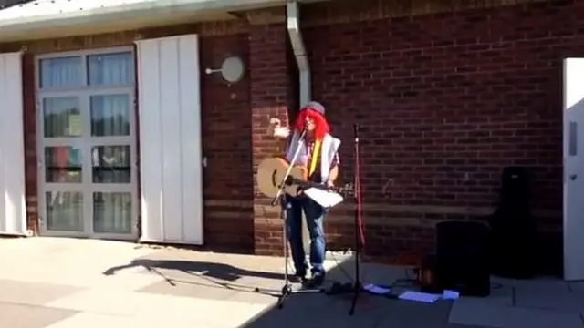 Postman Simon Goldsmith busking