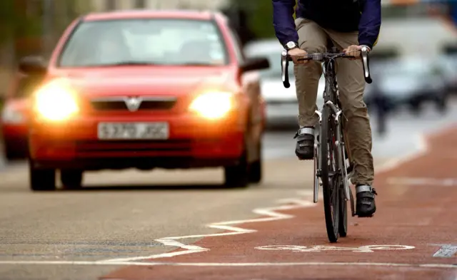 Cyclist and a car