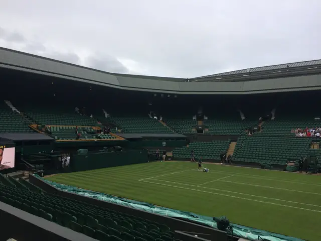 Linesman painting Centre Court