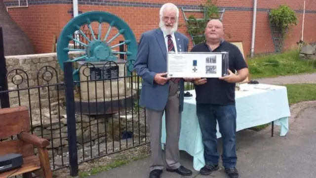 Jim Worgan and David Rushton with the George Cross