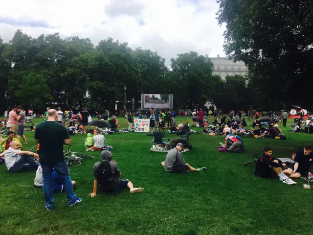 Crowds gather in Green Park, London to watch the RideLondon elite racers