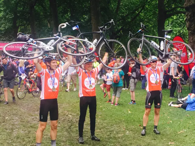 Geoff, Harry and Michael celebrate finishing RideLondon 100