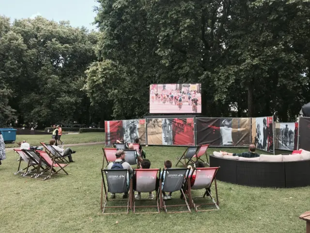 Spectators watch RideLondon on deckchairs in Green Park