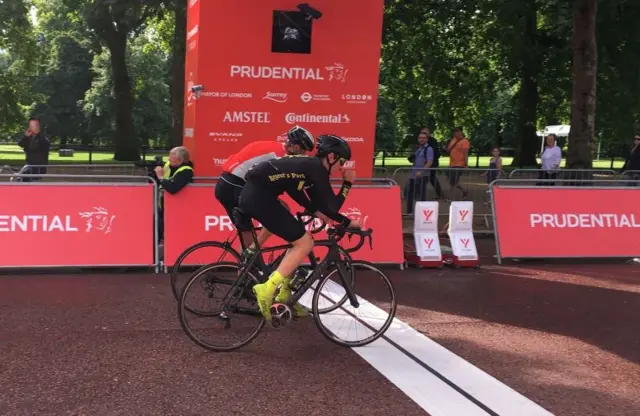 Two men crossing the finish line at RideLondon