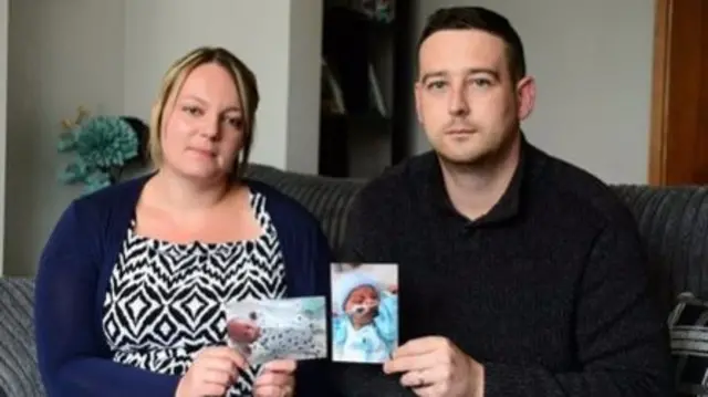 Gemma and Anthony Brookes with photos of their babies