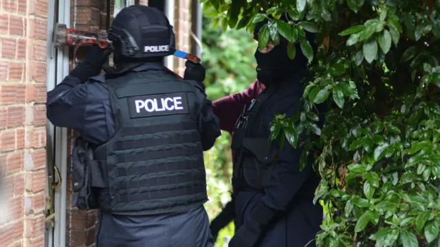 Police officers during Monday's raids in Ipswich