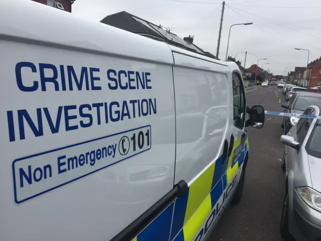 Police van at crime scene