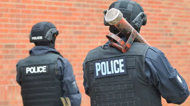 Police officers during Monday's raids in Ipswich