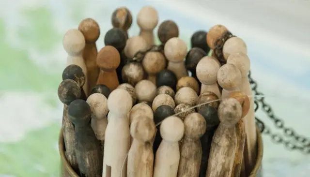 Wooden pegs in a wooden bowl
