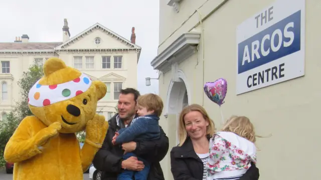 Family with Pudsey bear