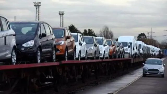 Cars being loaded onto a train